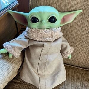 STAR Wars character, Baby Yoda has soulful eyes and an enigmatic smile. Iconic!
